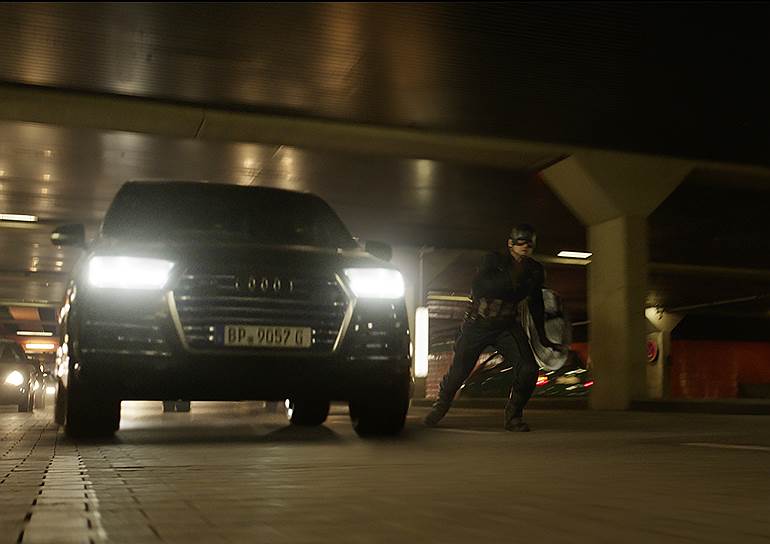 Captain America (Chris Evans) besides an Audi SQ7.