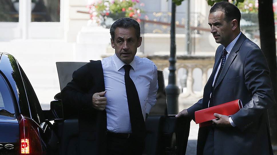 Бывший президент Франции Никола Саркози (слева)