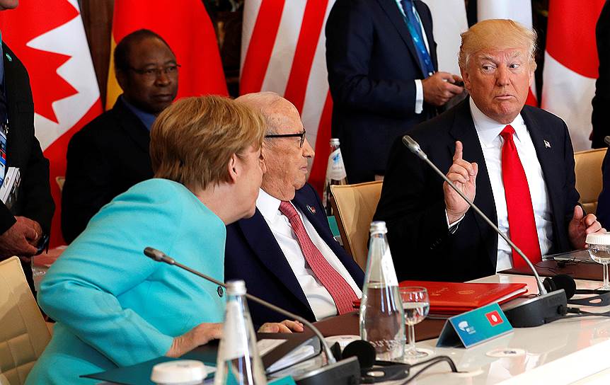 Канцлер Германии Ангела Меркель и президент США Дональд Трамп (слева)