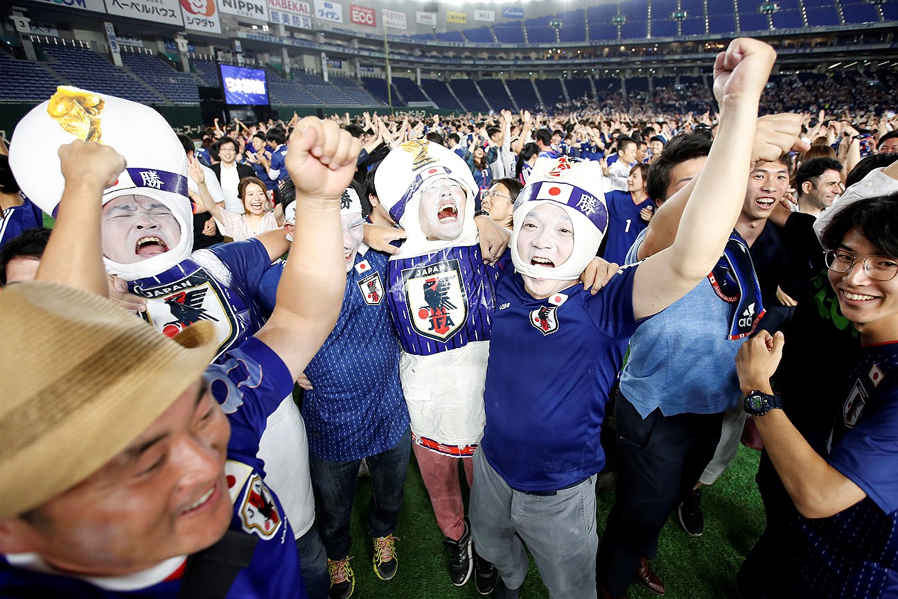 Japanese fans celebrate the victory after the World Cup Group H soccer match Colombia vs Japan, at a public viewing event at Tokyo Dome in Tokyo, Japan June 19, 2018. 