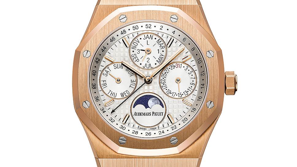 Audemars Piguet Royal Oak Perpetual Calendar. Калибр 5134 высотой в 4,31 мм с автоматическим подзаводом и заасом хода 40 часов. Вечный календарь: дни, недели, месяцы, годы, в том числе високосные, фазы Луны. Циферблат с рисунком Grande Tapisserie и люминесцентными индексами часов. Корпус из стали или розового золота диаметром 41 мм и толщиной в 9,50 мм защищен от воды
до 20 м глубины