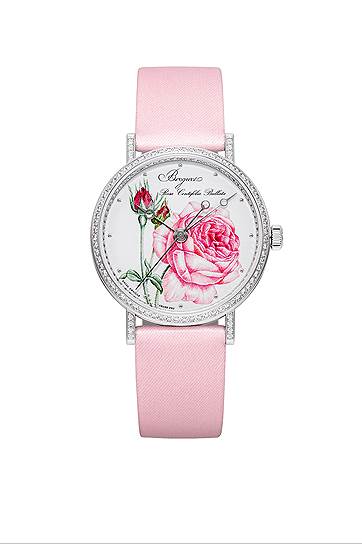 Breguet Classique Rose de la Reine. Корпус из белого золота 33,5 мм с 167 бриллиантами 0,915 карата. Эмалевый циферблат Grand feu Rosa Centifolia Bullata. Механизм с автоматическим подзаводом и резервом хода 38 часов. Кремниевый спуск. Водонепроницаемость 30 метров