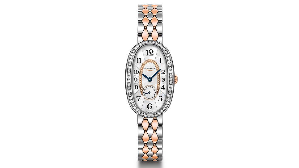 Longines Symphonette. Кварцевый механизм модели заключен в корпус в форме эллипса диаметром 18,9 x 29,4 мм из розового золота с бриллиантовым ободком циферблата. Перламутровый циферблат украшают бриллиантовые индексы, стрелки и логотип из розового золота 