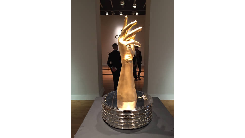 Золотая рука, символ и награда Grand Prix d’Horlogerie de Geneve